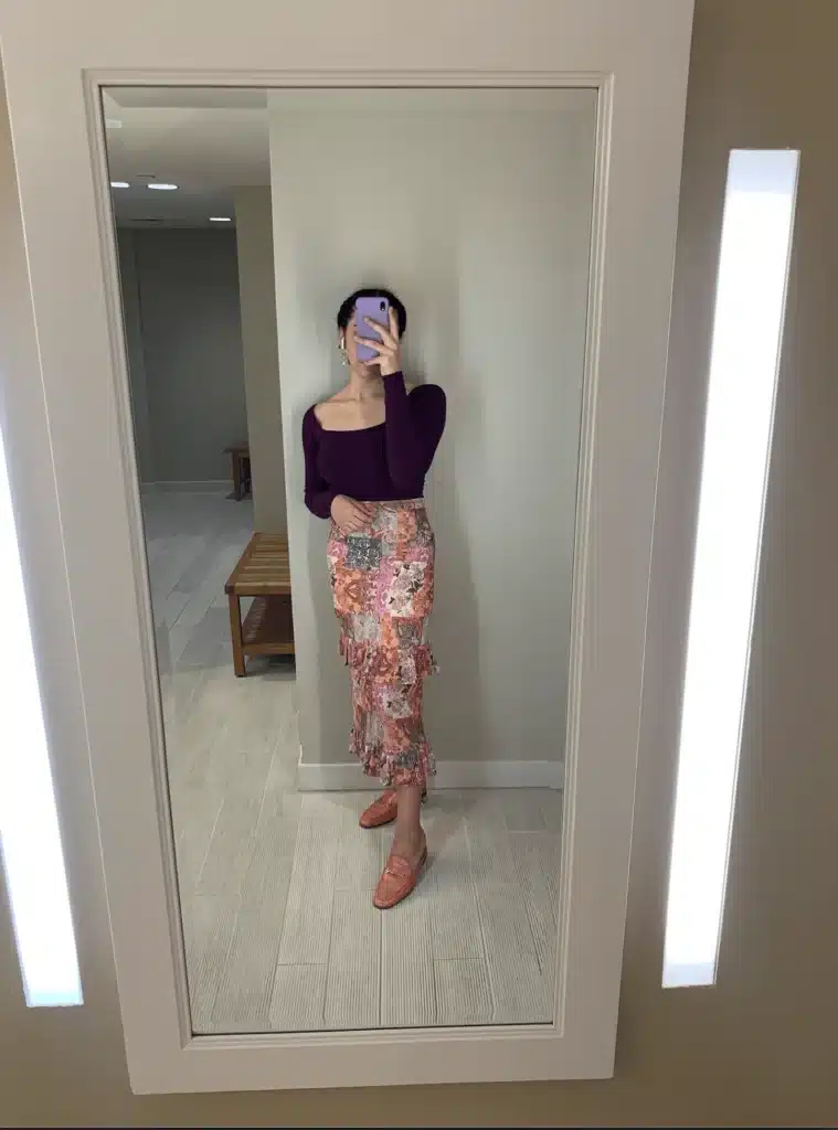 woman in printed midi skirt for fall