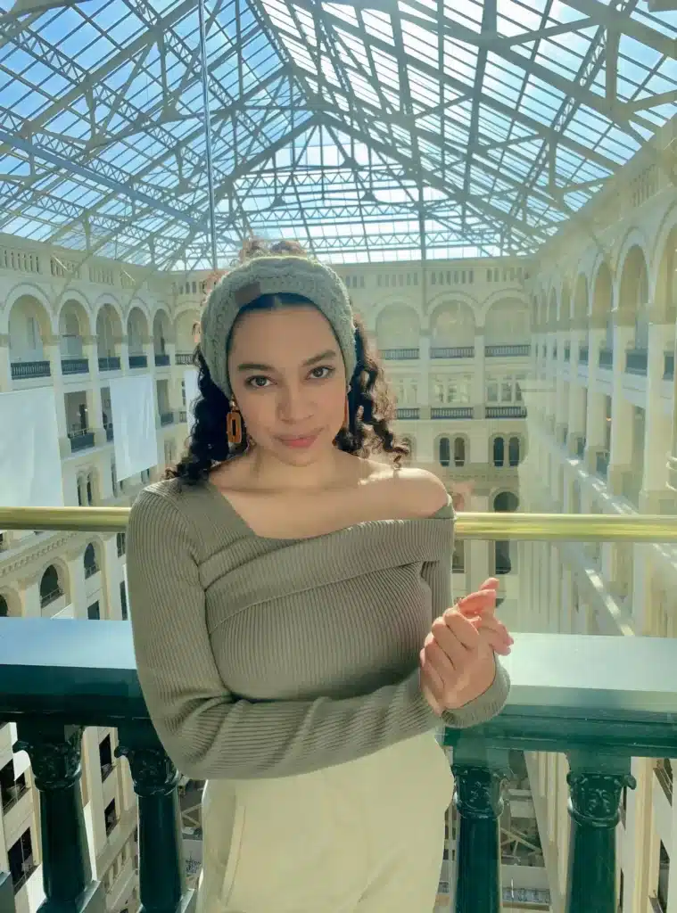 A thick headband and statement earrings are a power accessory duo.