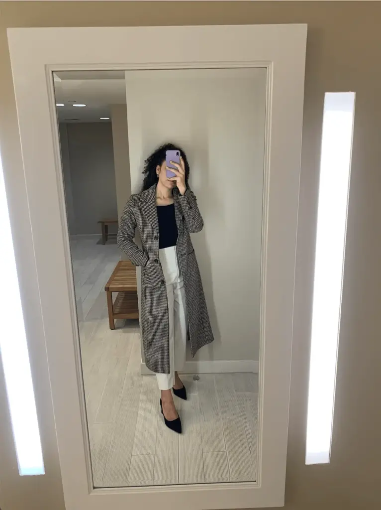 winter capsule wardrobe outfit idea with trench coat and trousers