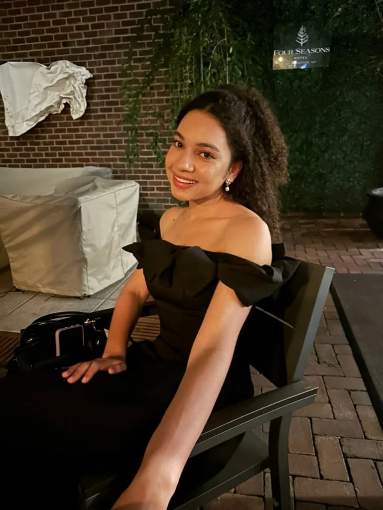 woman in off shoulder dress outfit four seasons hotel