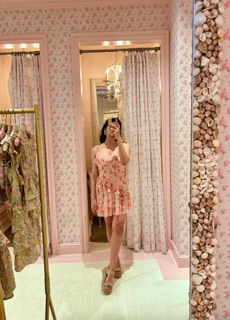 woman in pink mini LoveShackFancy coquette dress