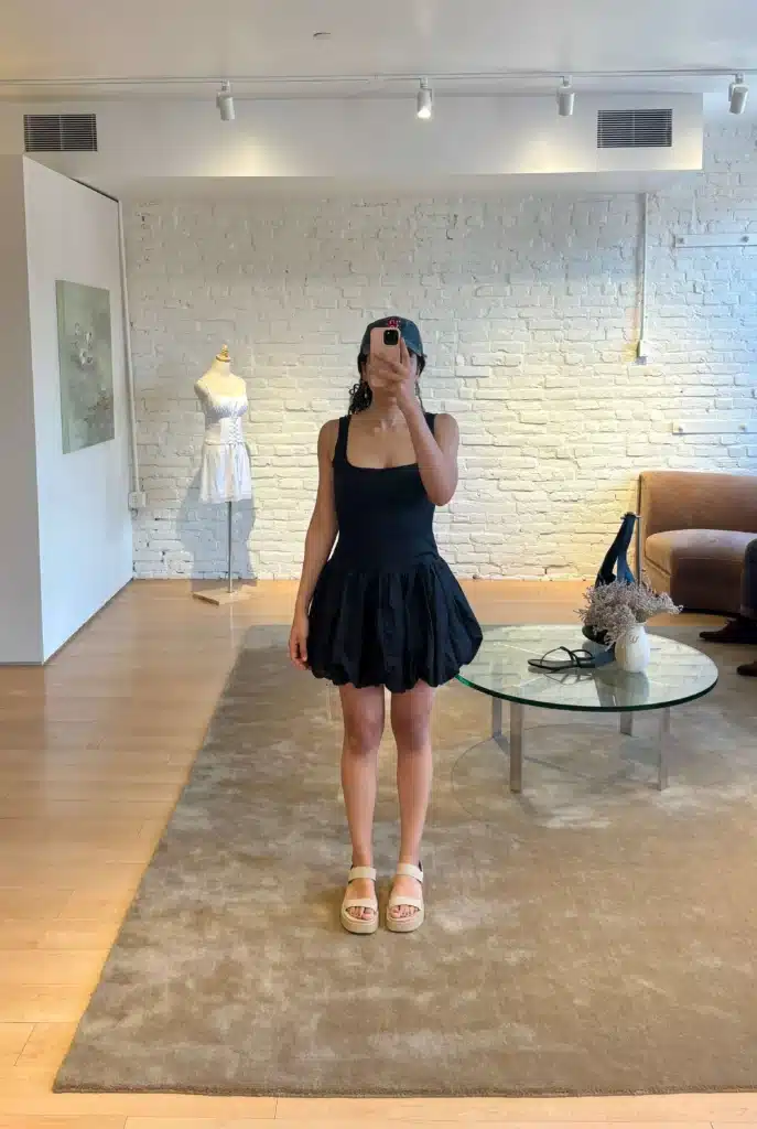 petite woman shopping for little black dress 