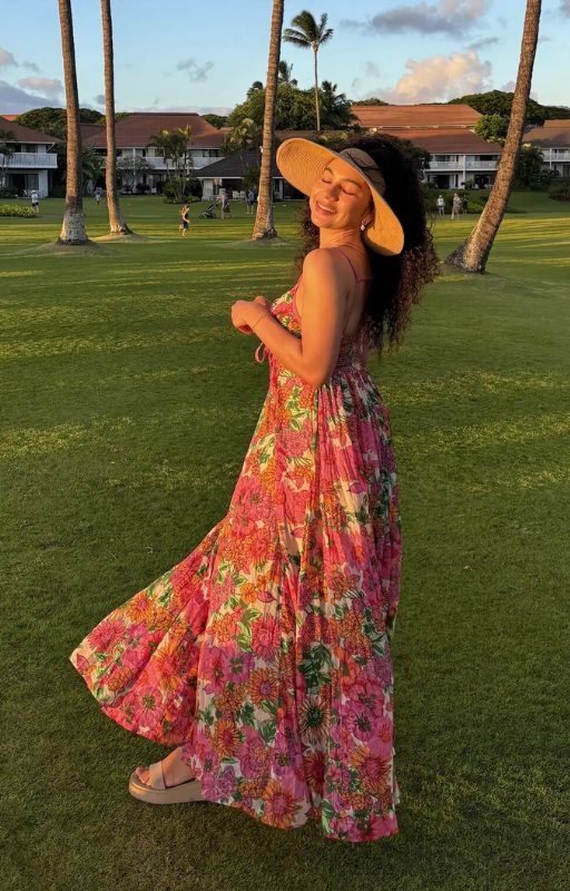 woman smiling in Free People maxi dress at sunset