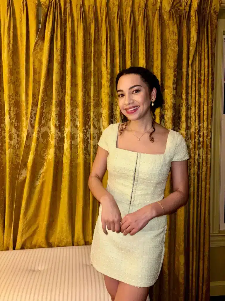 Woman in Amanda Uprichard skirt set from BNTO clothing rental