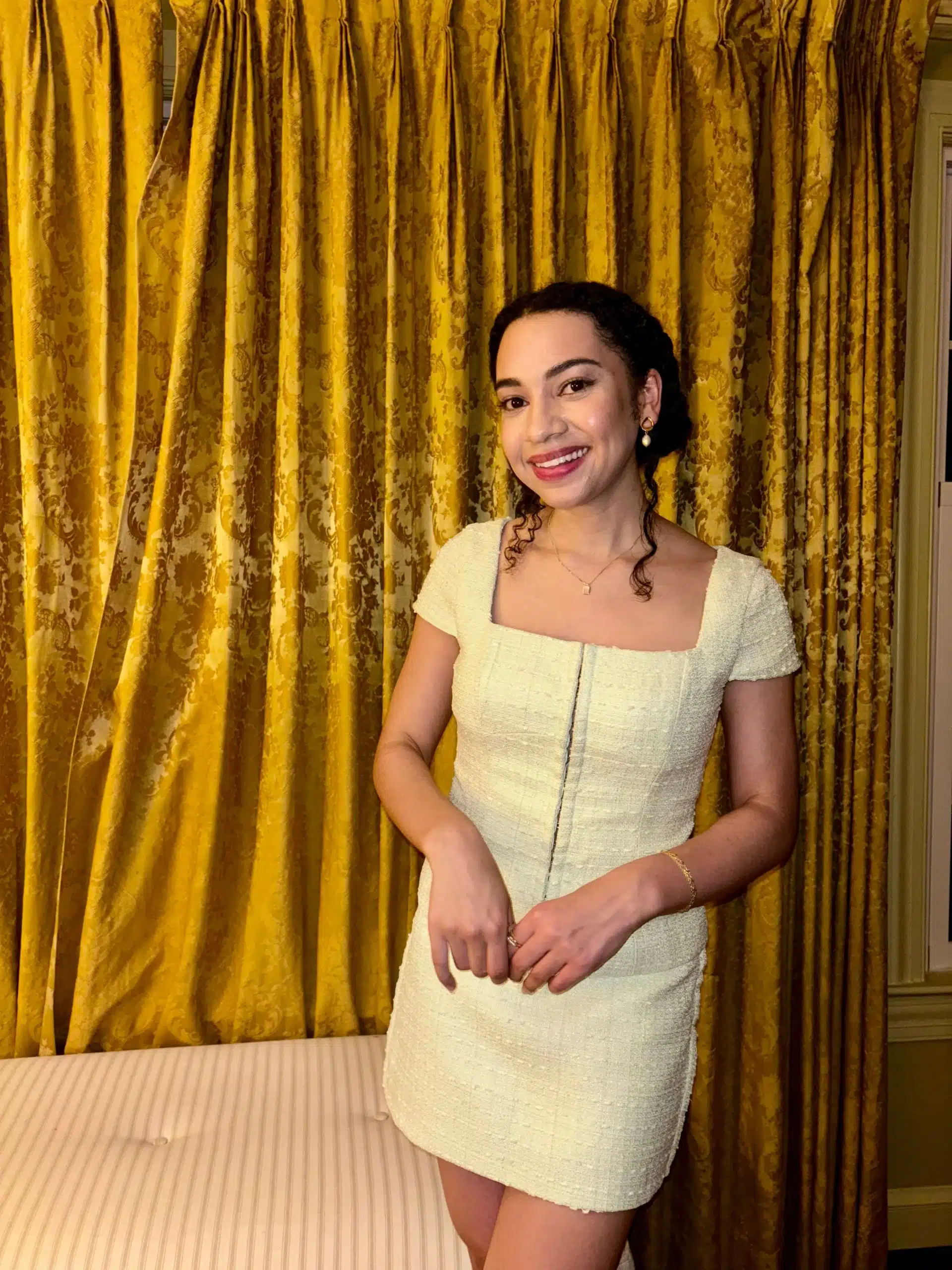 Woman in Amanda Uprichard skirt set from BNTO clothing rental