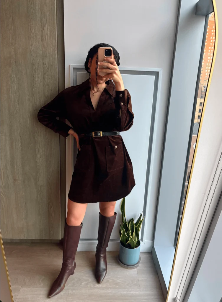 Woman in chic monochrome brown dress and boots