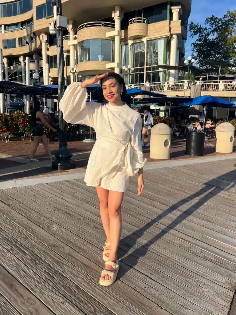 Woman in Andrea Iyamah romper from BTNO clothing rental