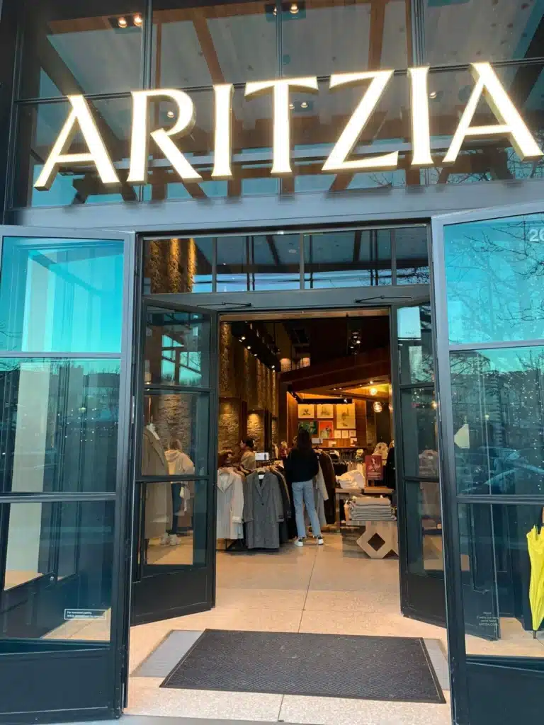 Aritzia storefront entrance with clothing inside