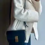 woman wearing leather august ateliers bag